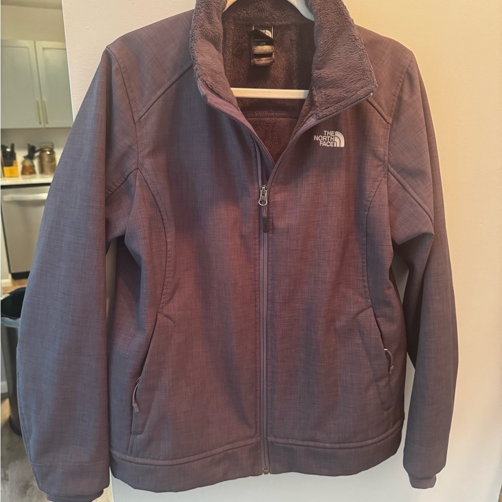 The North Face Deep Purple weather proof Jacket lined with fleece.